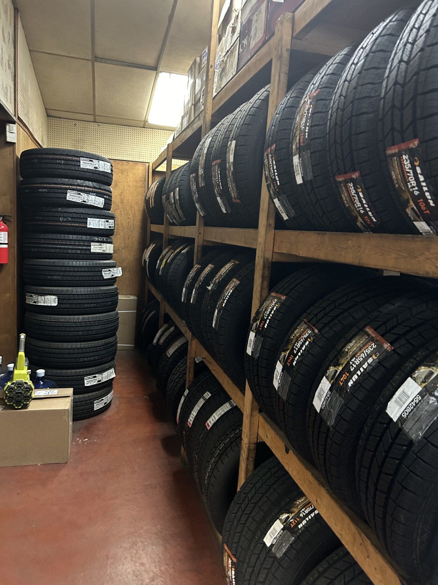 A warehouse filled with lots of tires on shelves