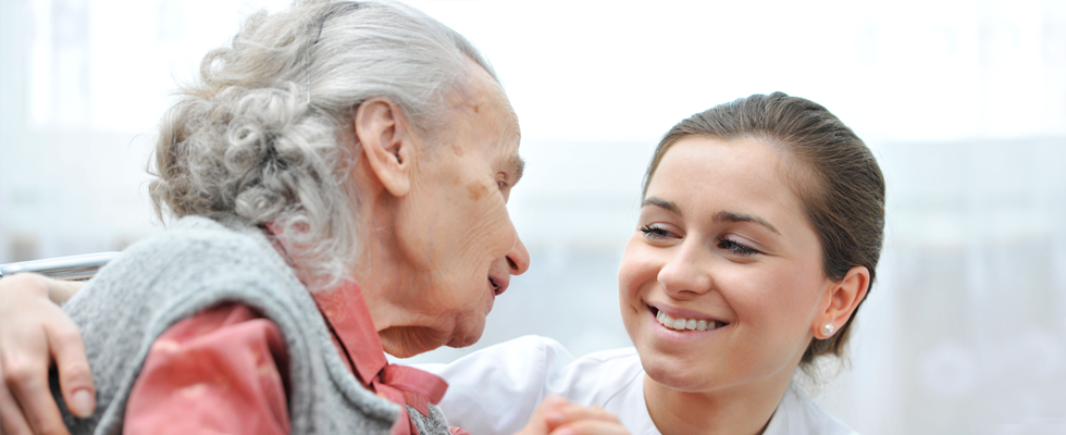 Old woman with nurse smiling