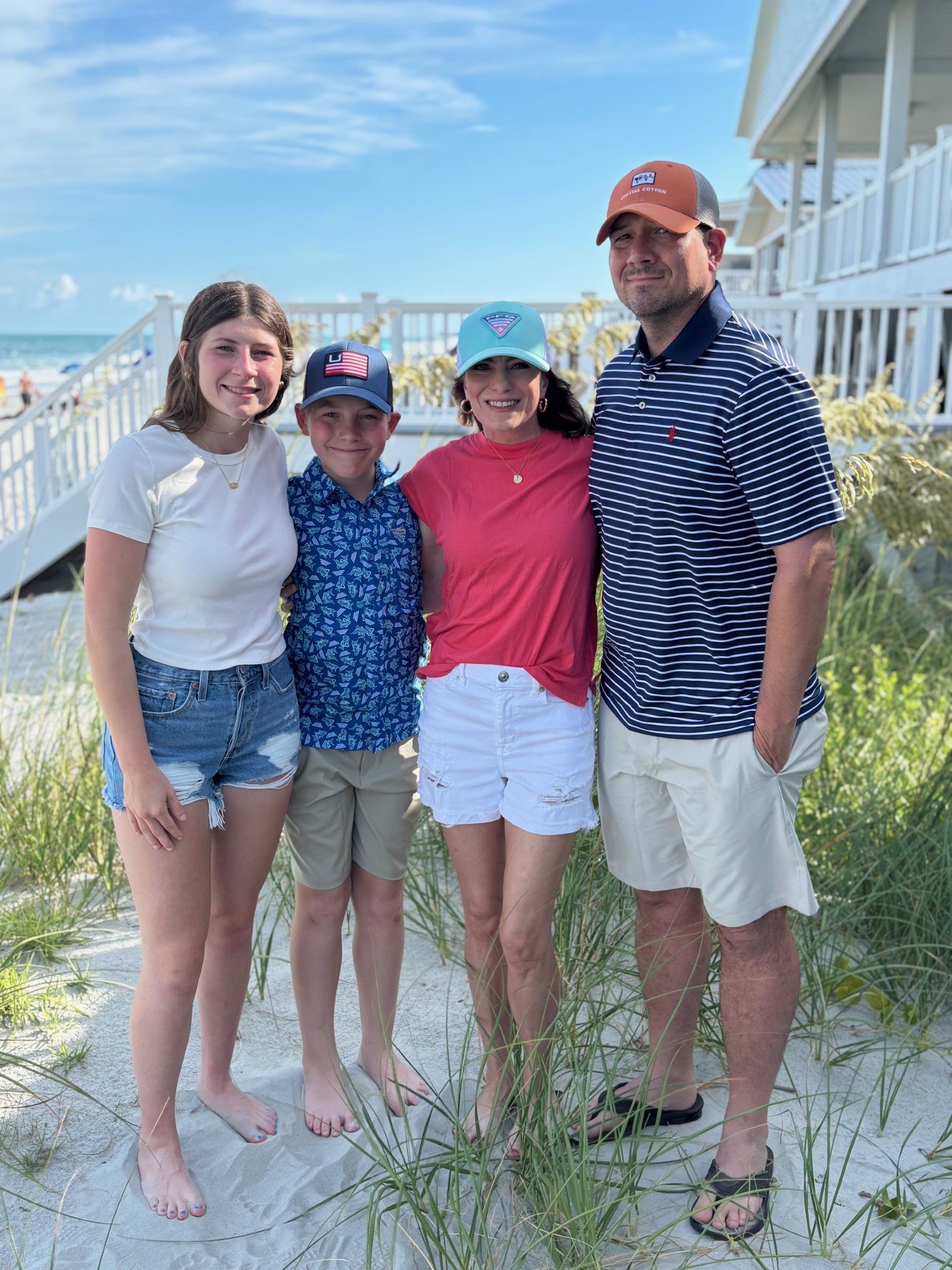 Aaron Reimer, CEO of Carolina Specialty Fitness, and his family with a beach in the background