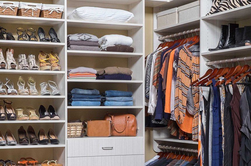 walk-in closet filled with clothes