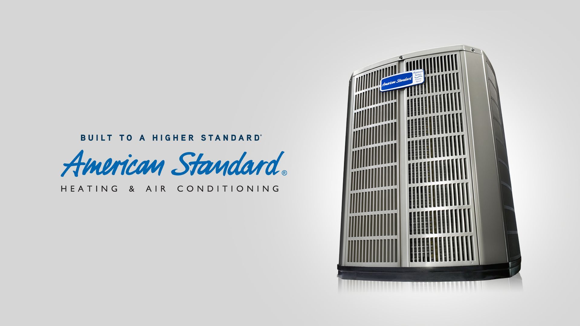 American Standard heating and air conditioning logo beside a gray HVAC unit