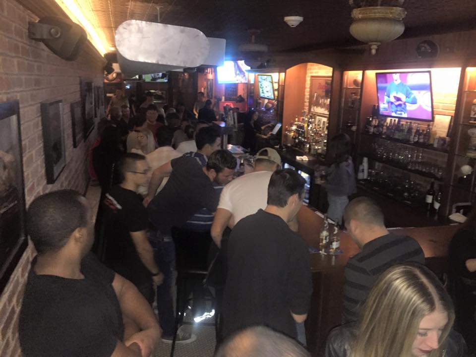 people watching games inside the tavern