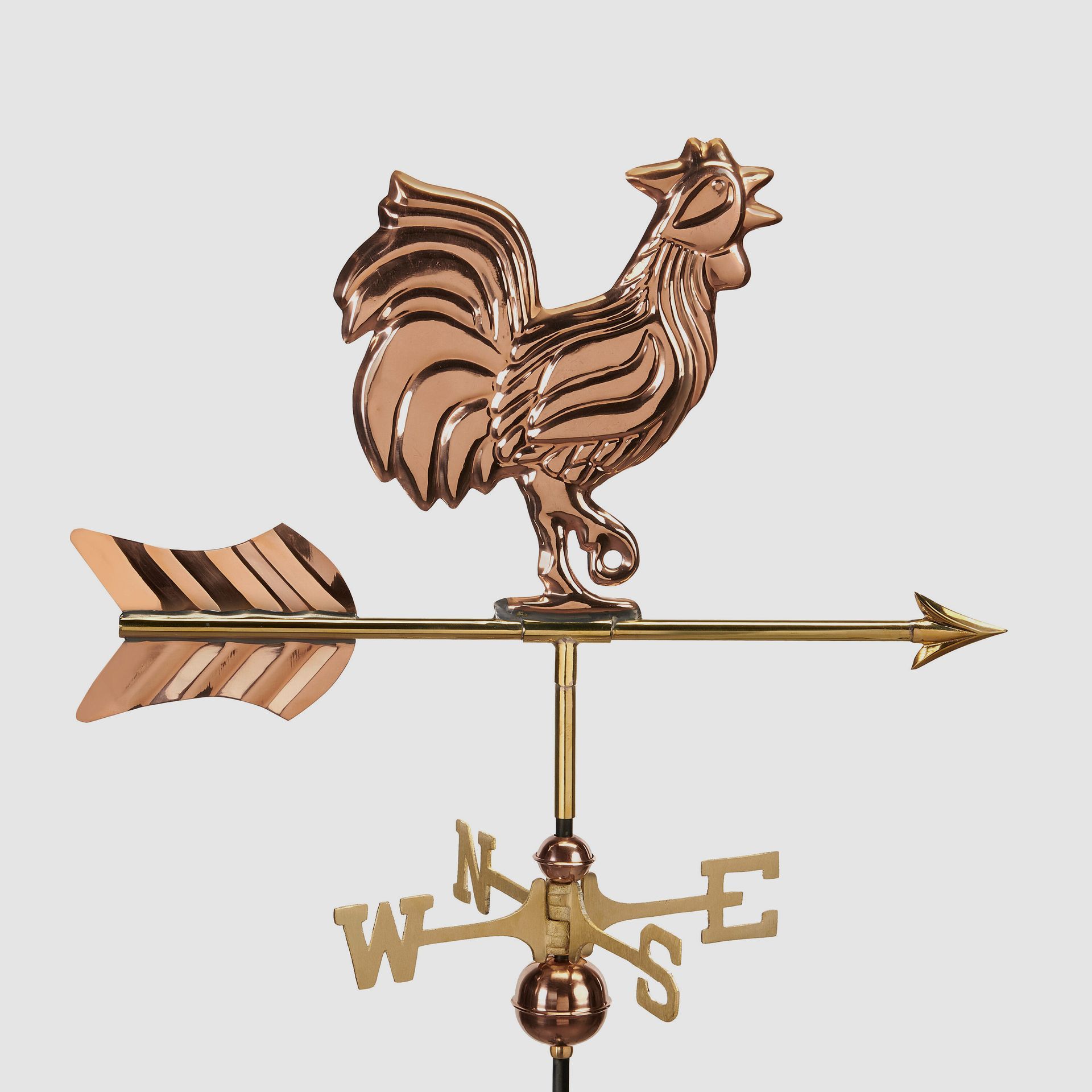 a weather vane with a rooster on top of it