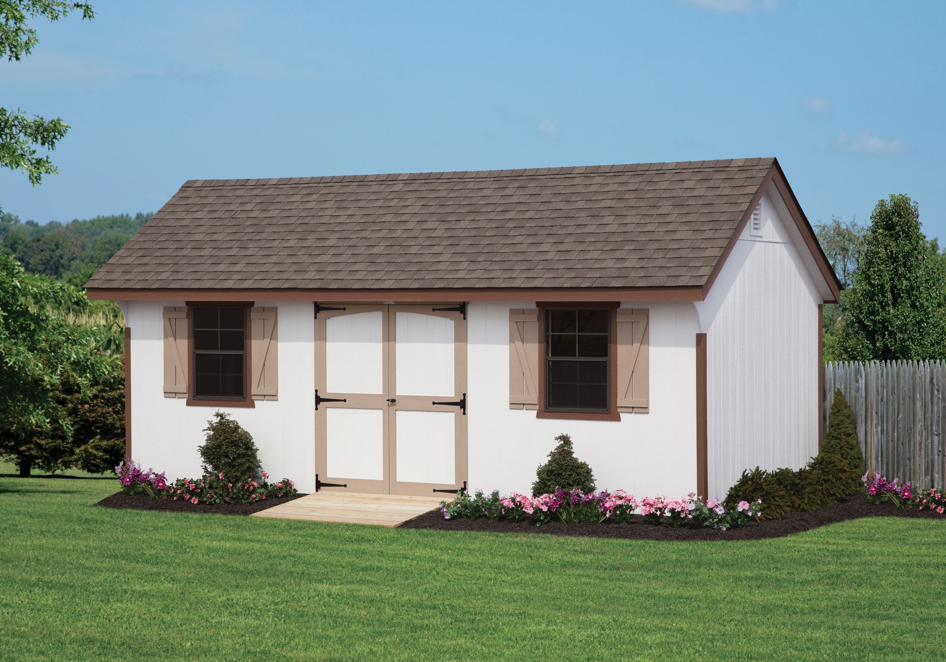 a small white building with a brown roof and shutters