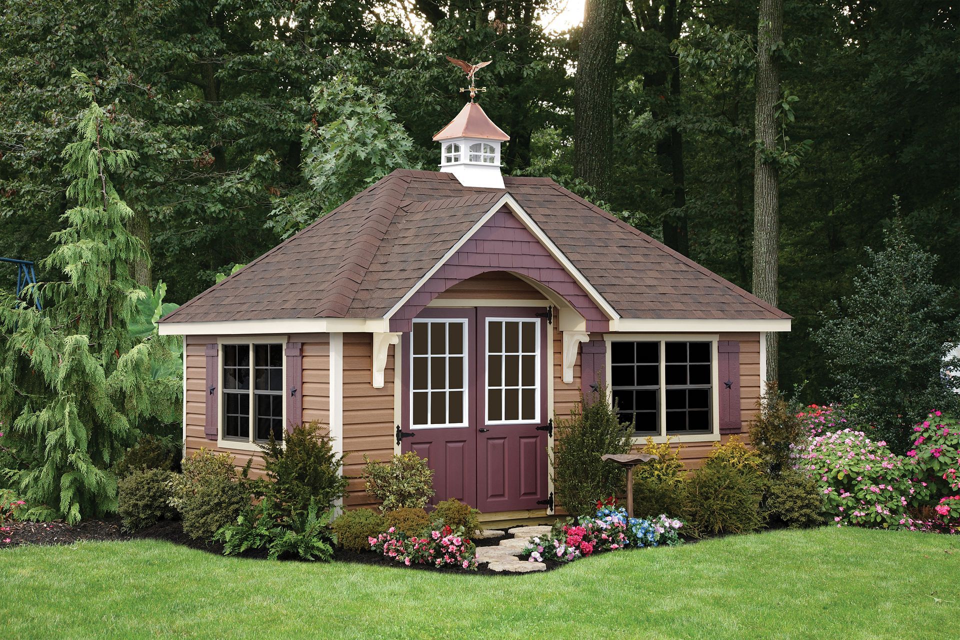 a small house with a weather vane on top of it