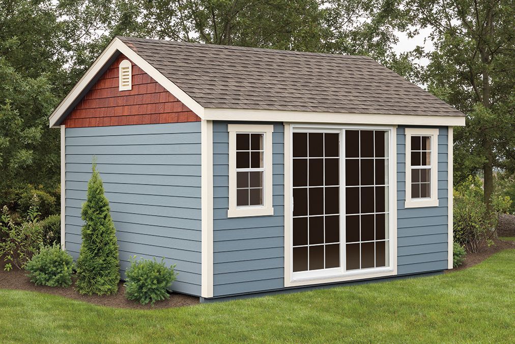 a blue and white shed with sliding glass doors