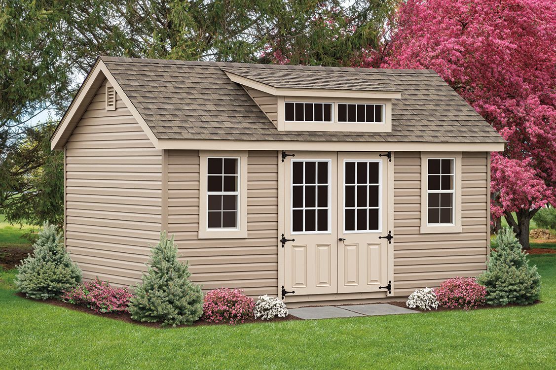 a small house with a roof that is covered in shingles