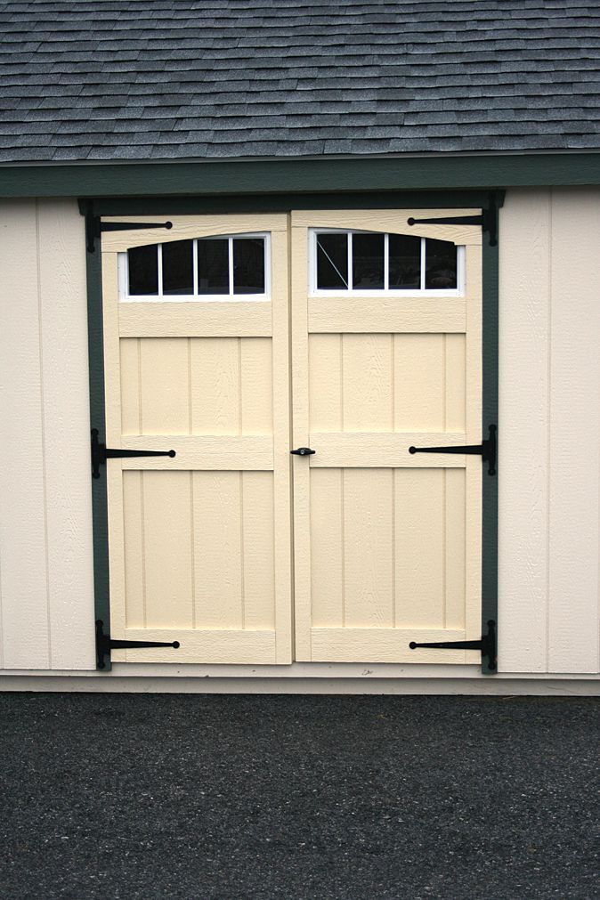 a white garage door with a window on it