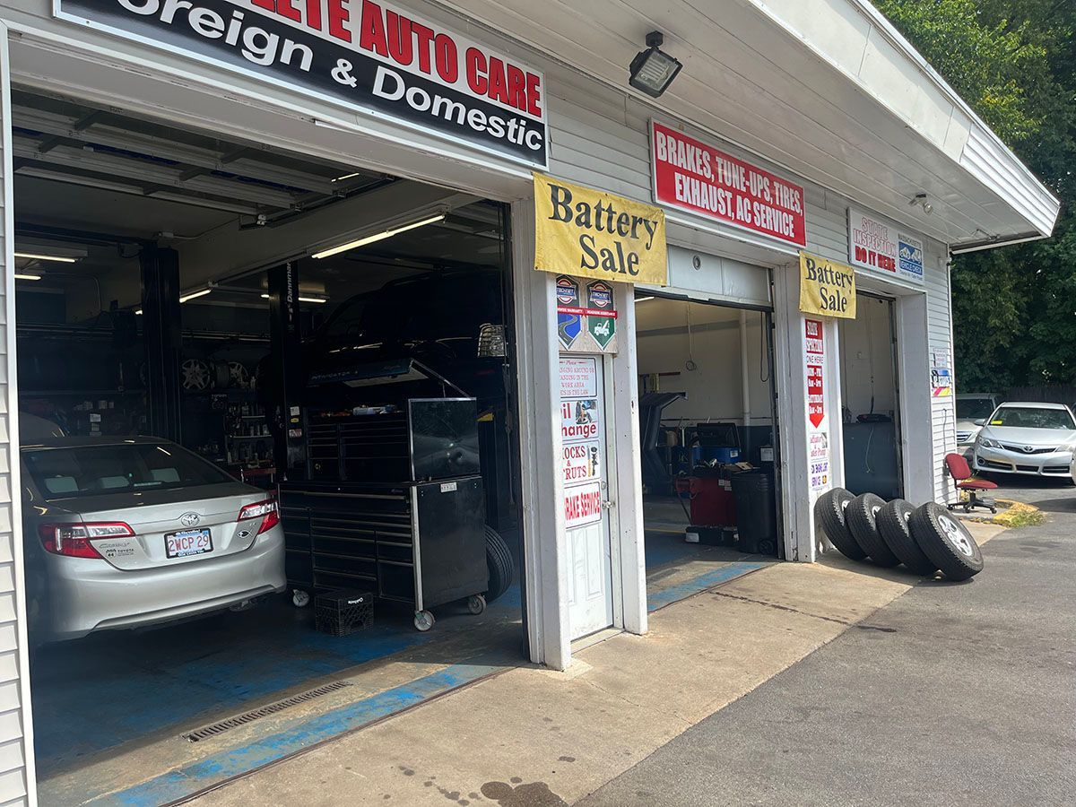 A car is parked in the garage of a car dealership.