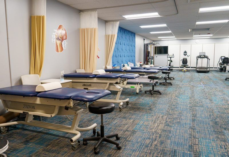 There are a lot of tables and chairs in this room