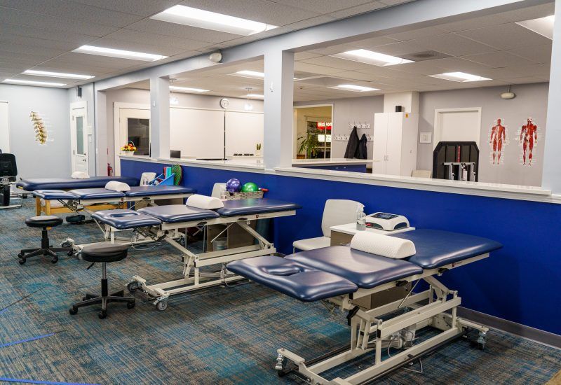 A large room with a lot of tables and chairs in it