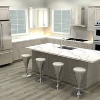 A modern kitchen with a large island, stools, and stainless steel appliances.