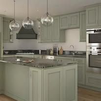 Green kitchen with pendant lights, granite countertop, and sage green cabinetry.