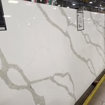 White quartz slab with gray veining.
