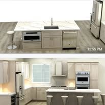 Kitchen with white cabinets, island, and stainless steel appliances.