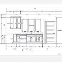 Architectural drawing of a wall with window and cabinet measurements, plus a door.