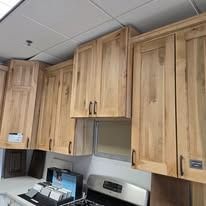 Wooden kitchen cabinets in various styles and configurations.