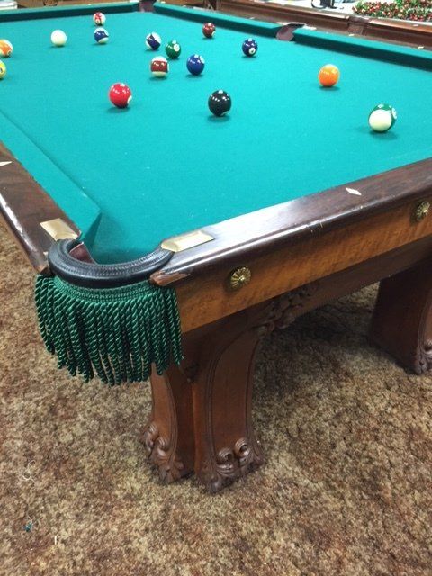 Used pool table with scattered balls