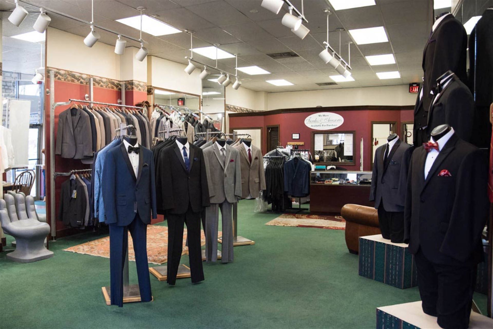 A store filled with lots of suits and tuxedos