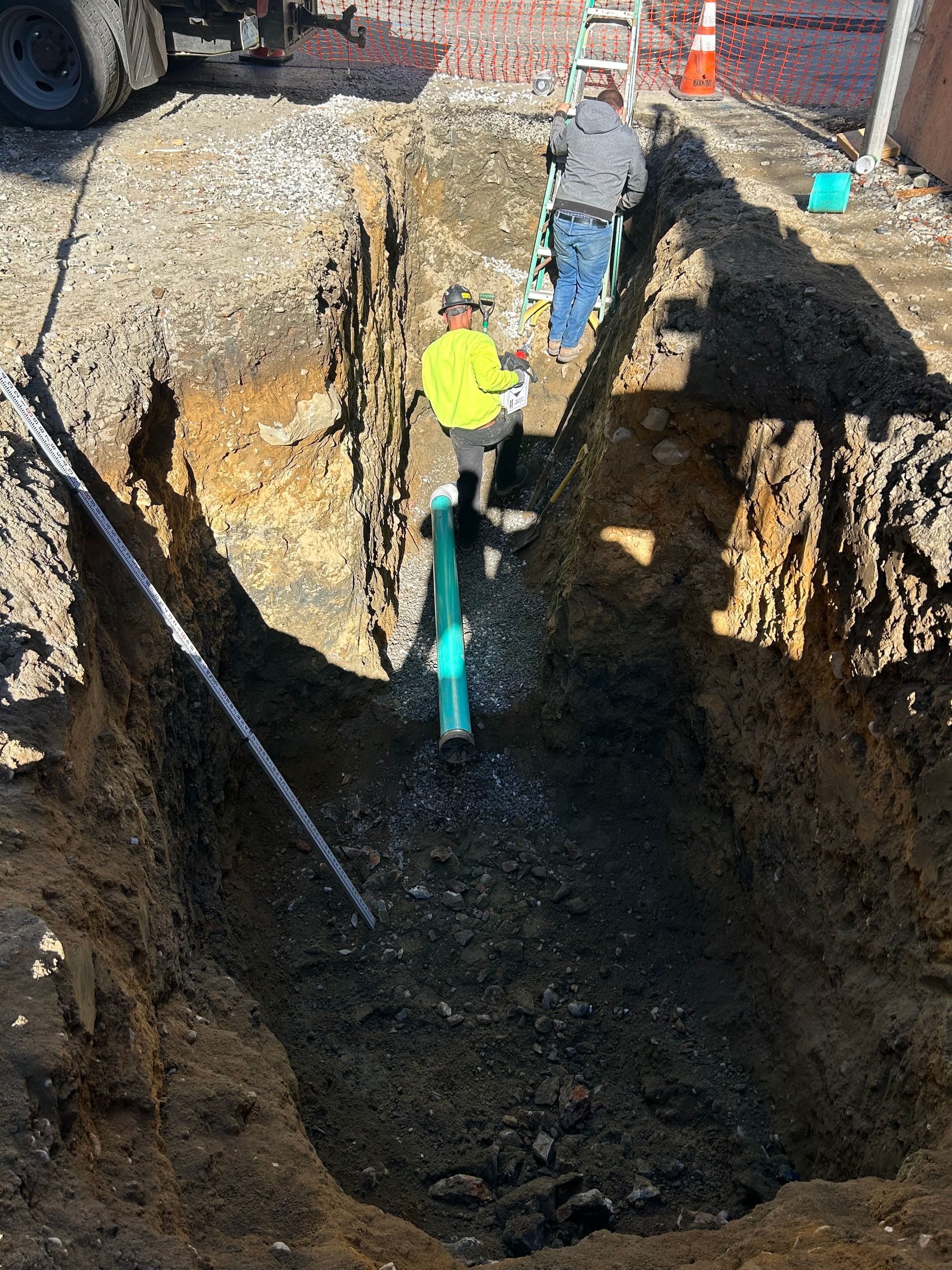 A man is digging a hole in the ground.