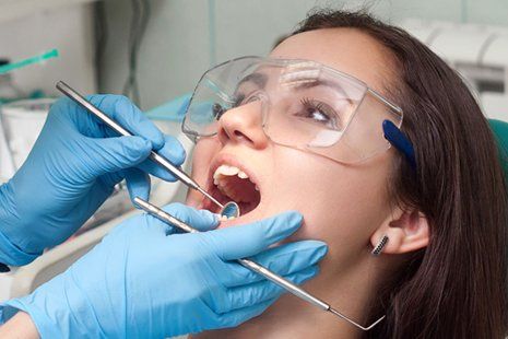 Check the teeth of woman