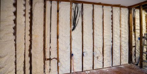 A room with a wall covered in spray foam