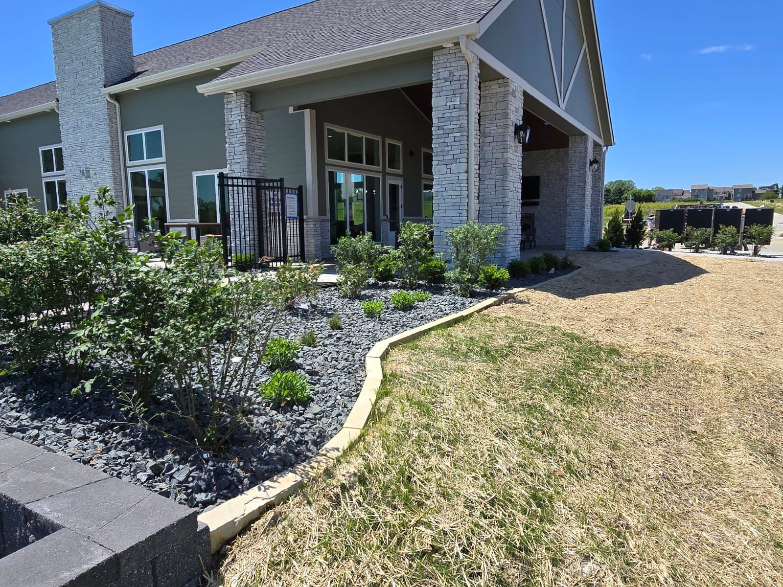 A large house with a lush green lawn in front of it