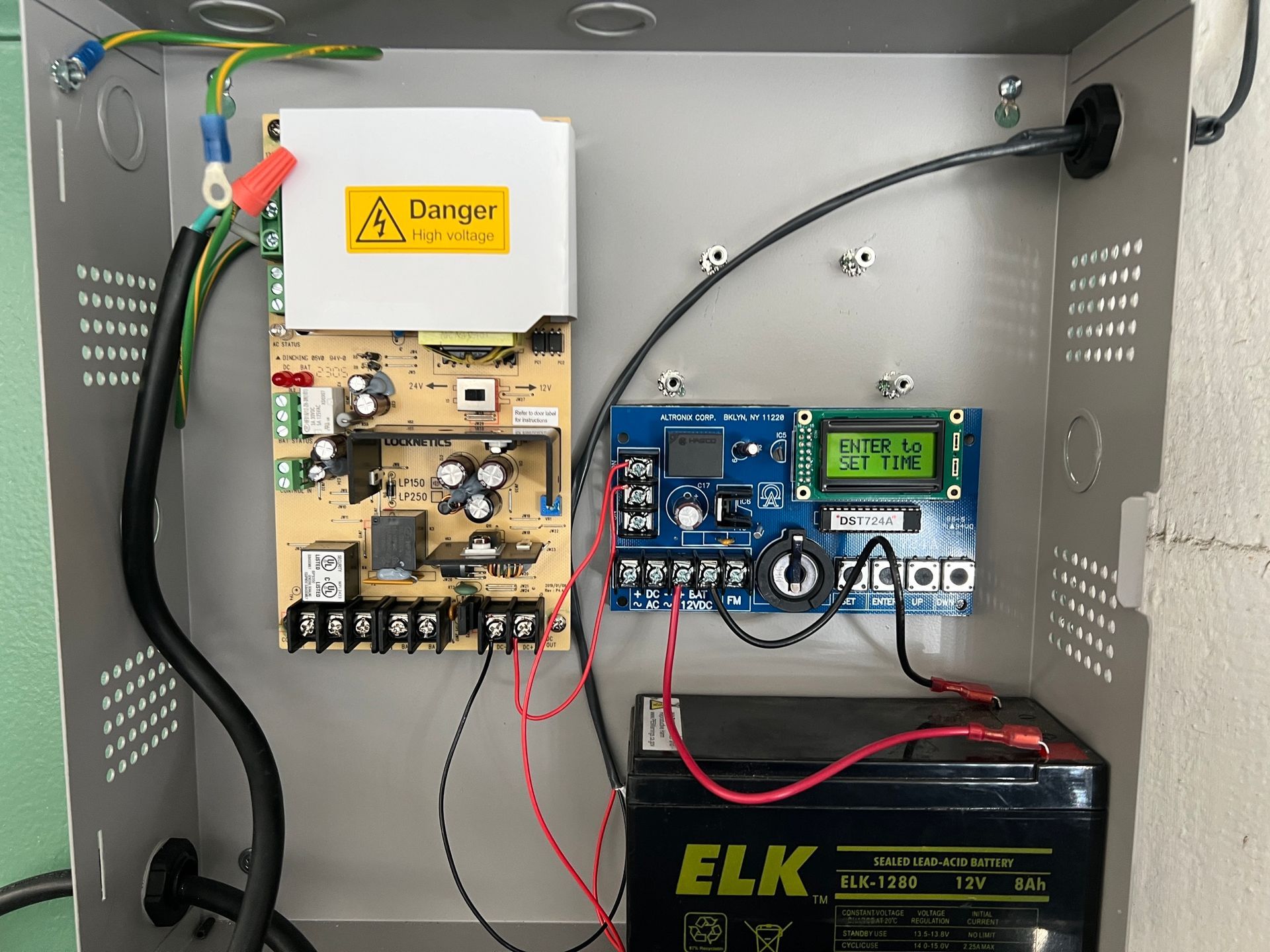 The inside of a box with a battery that says elk on it