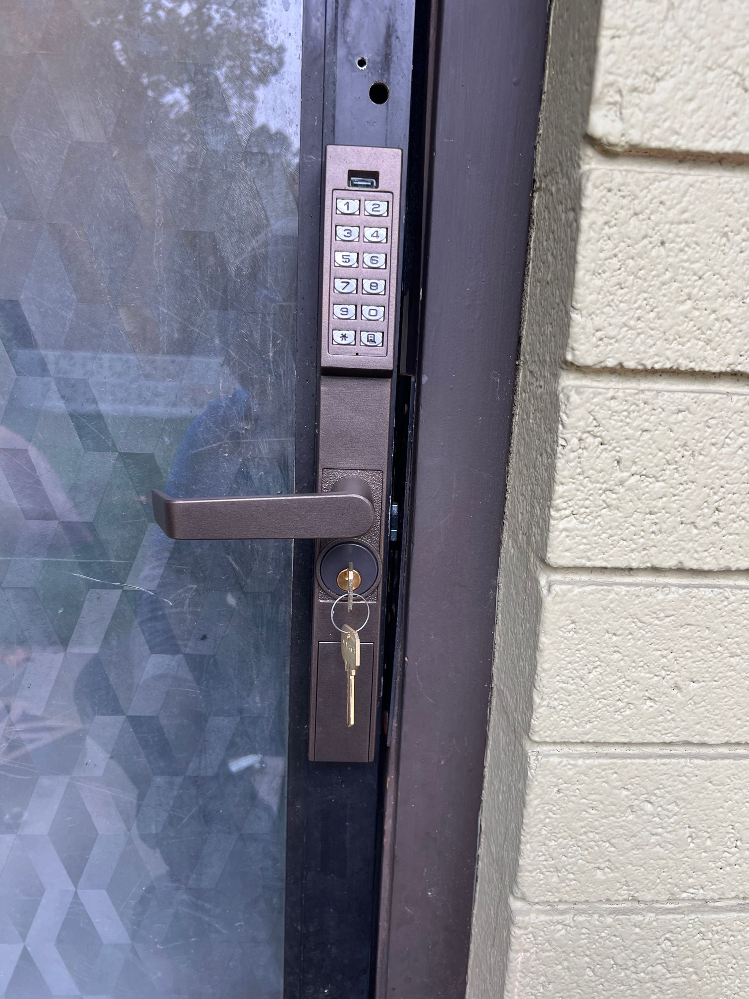 A close up of a door with a key on it.