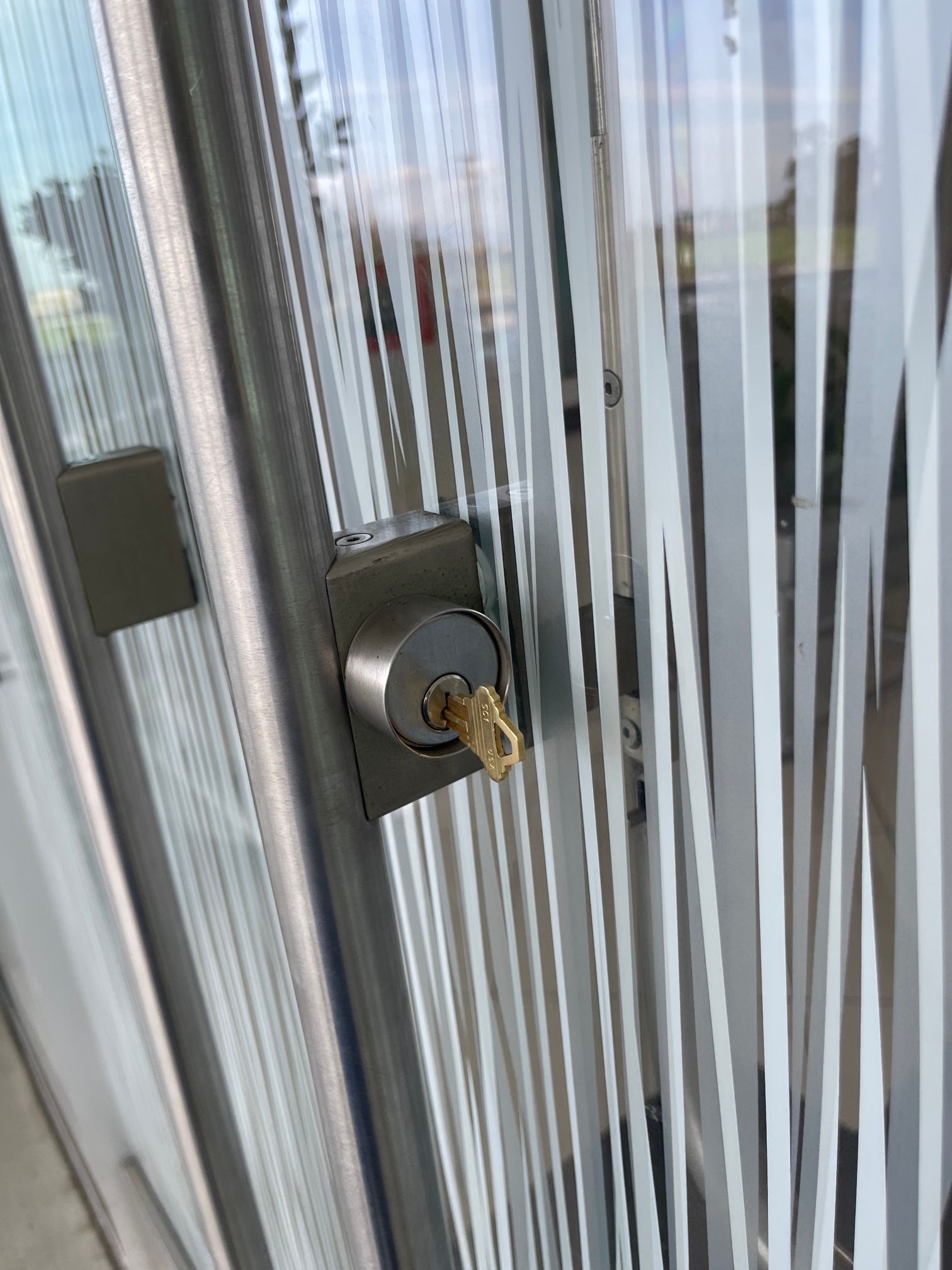 A close up of a door with a key in it.