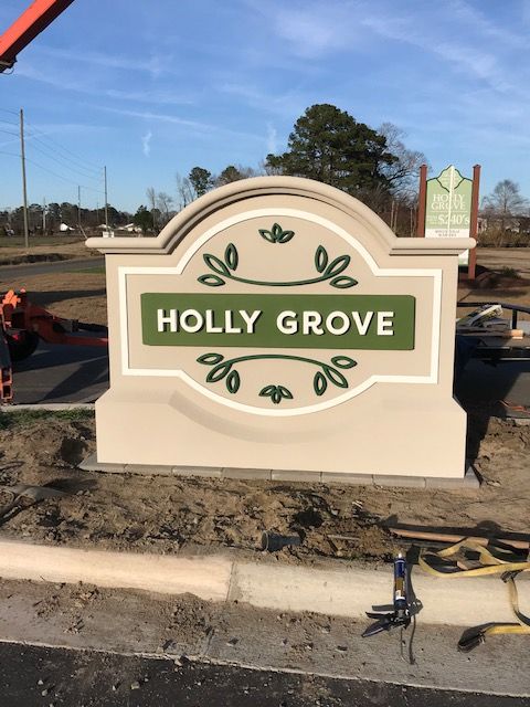 A sign that says holly grove on it