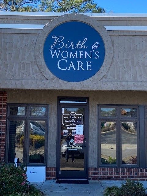A building with a sign that says birth & women 's care