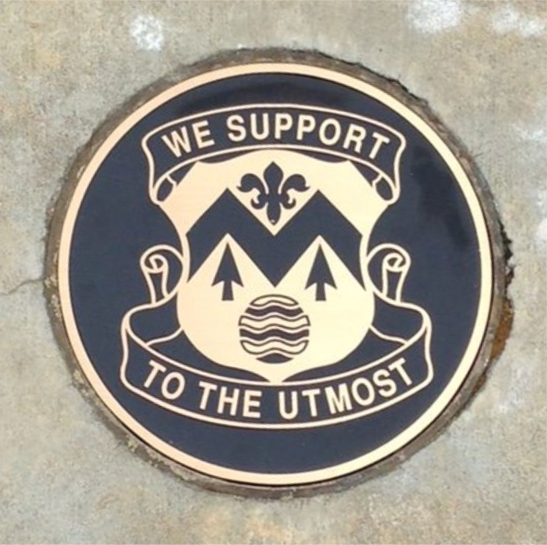 A manhole cover that says we support to the utmost
