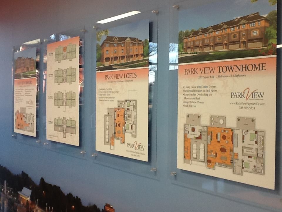 A row of posters on a wall that say park view townhome