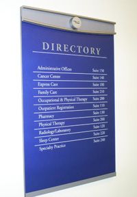 A blue directory with a list of departments on it