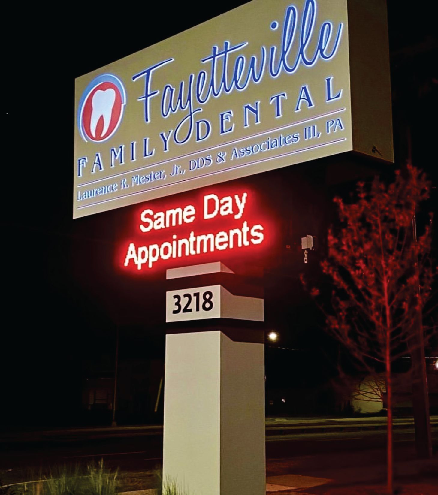 A sign for fayetteville family dental advertises same day appointments