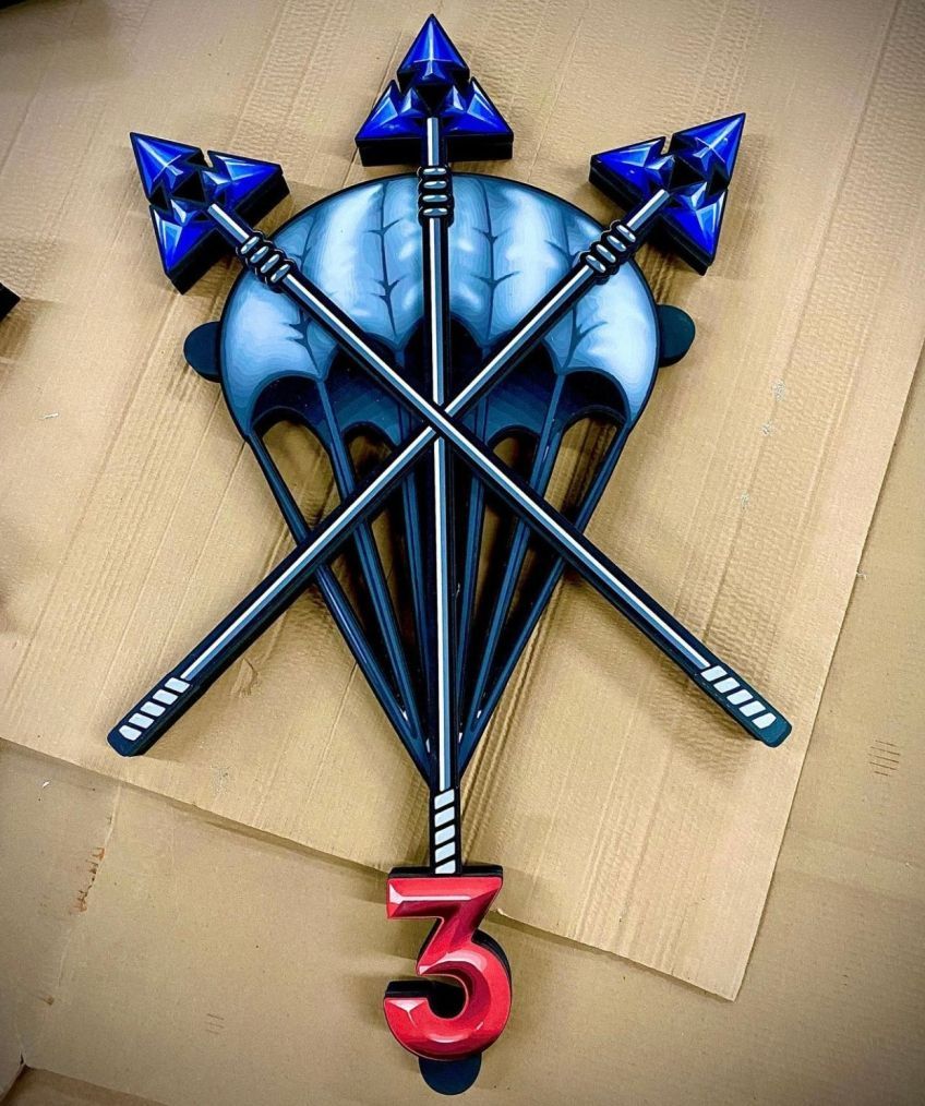 A parachute with arrows and the number 3 on it