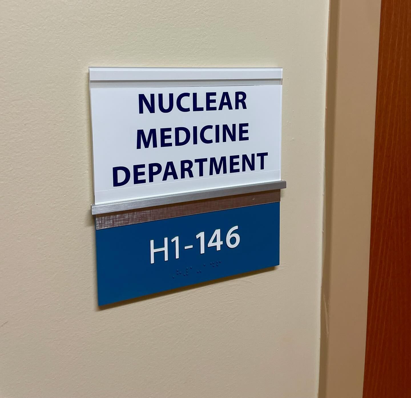 A sign on a wall that says nuclear medicine department