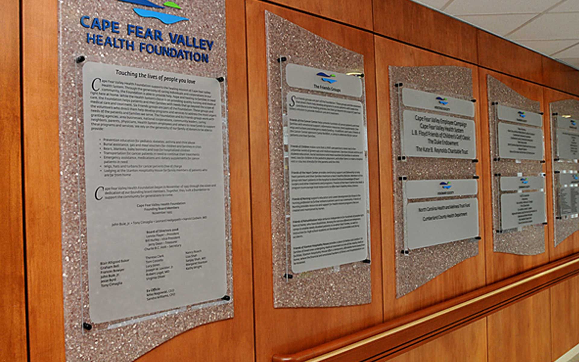 A wall with a sign that says cape fear valley health foundation