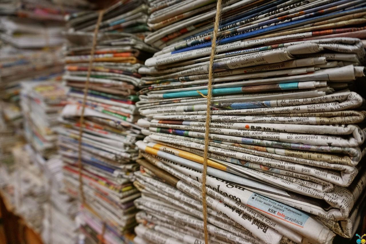 Stacks of newspapers bundled with jute string