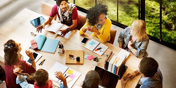 a diversity committee works at a conference table