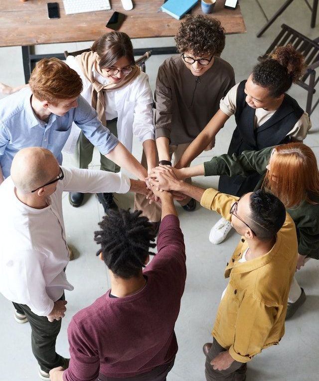 A group huddle hand stack