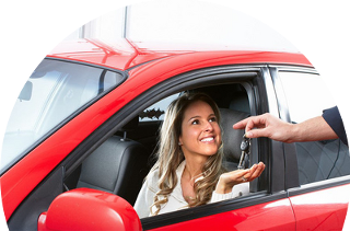 A happy customer in a red car