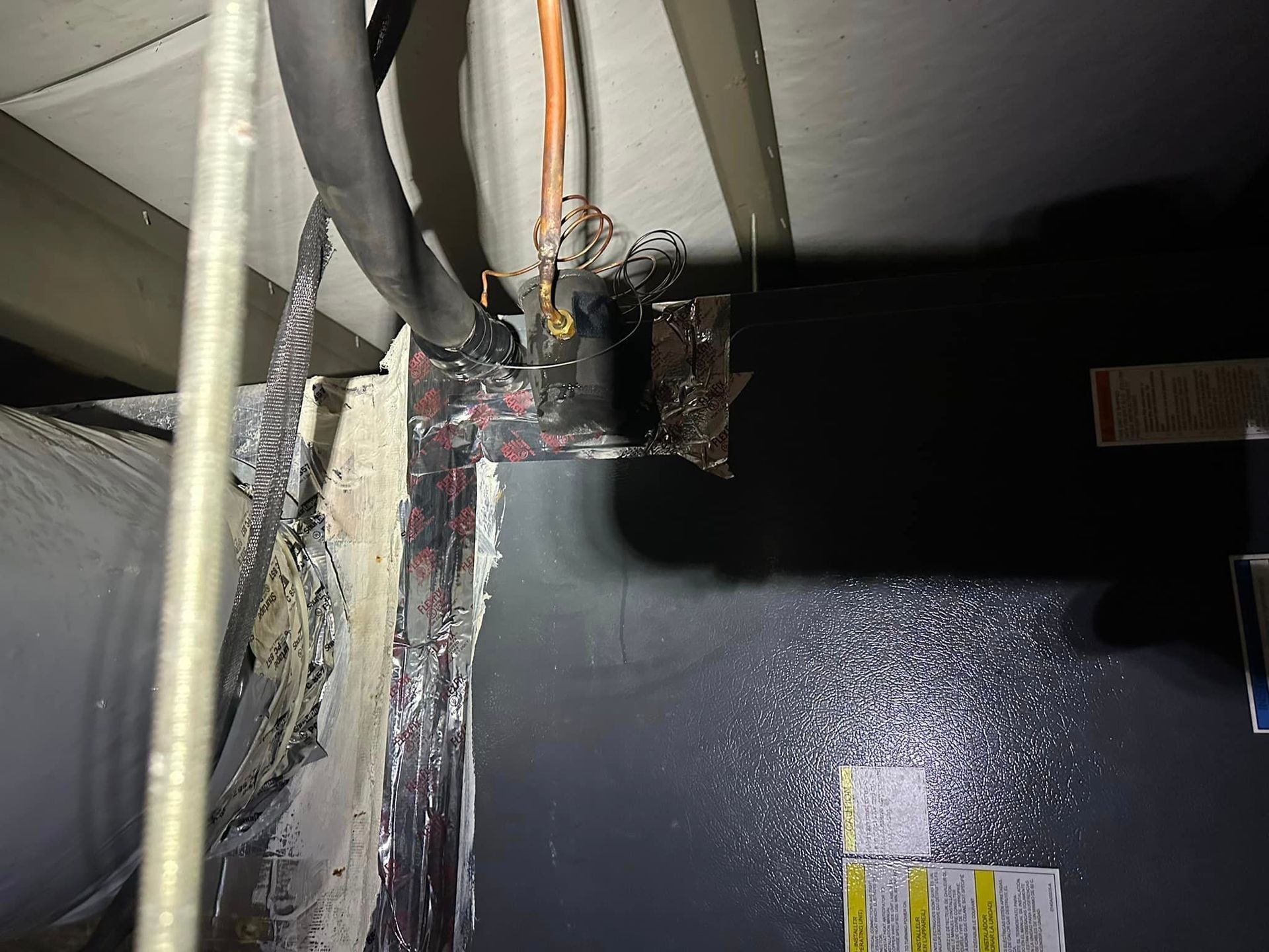 A black box with a bunch of wires coming out of it