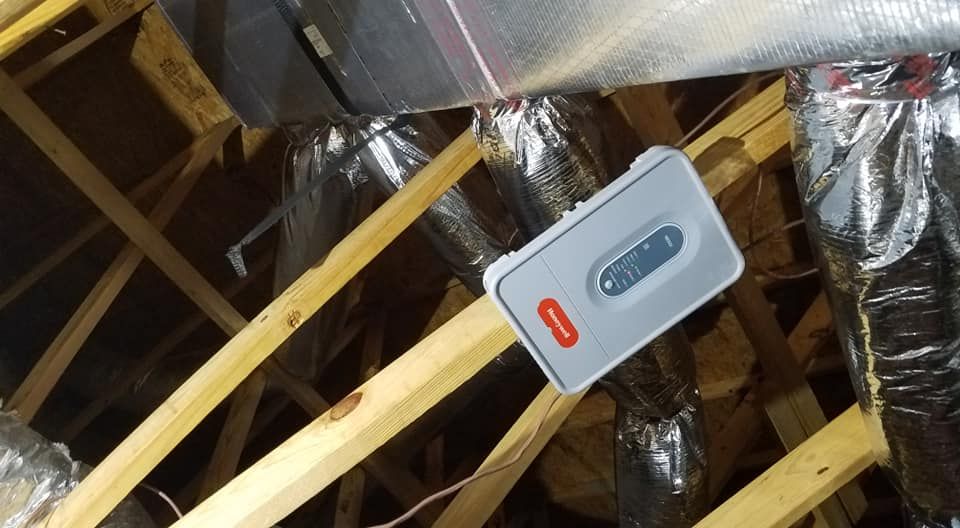 A white box is sitting on top of a wooden structure