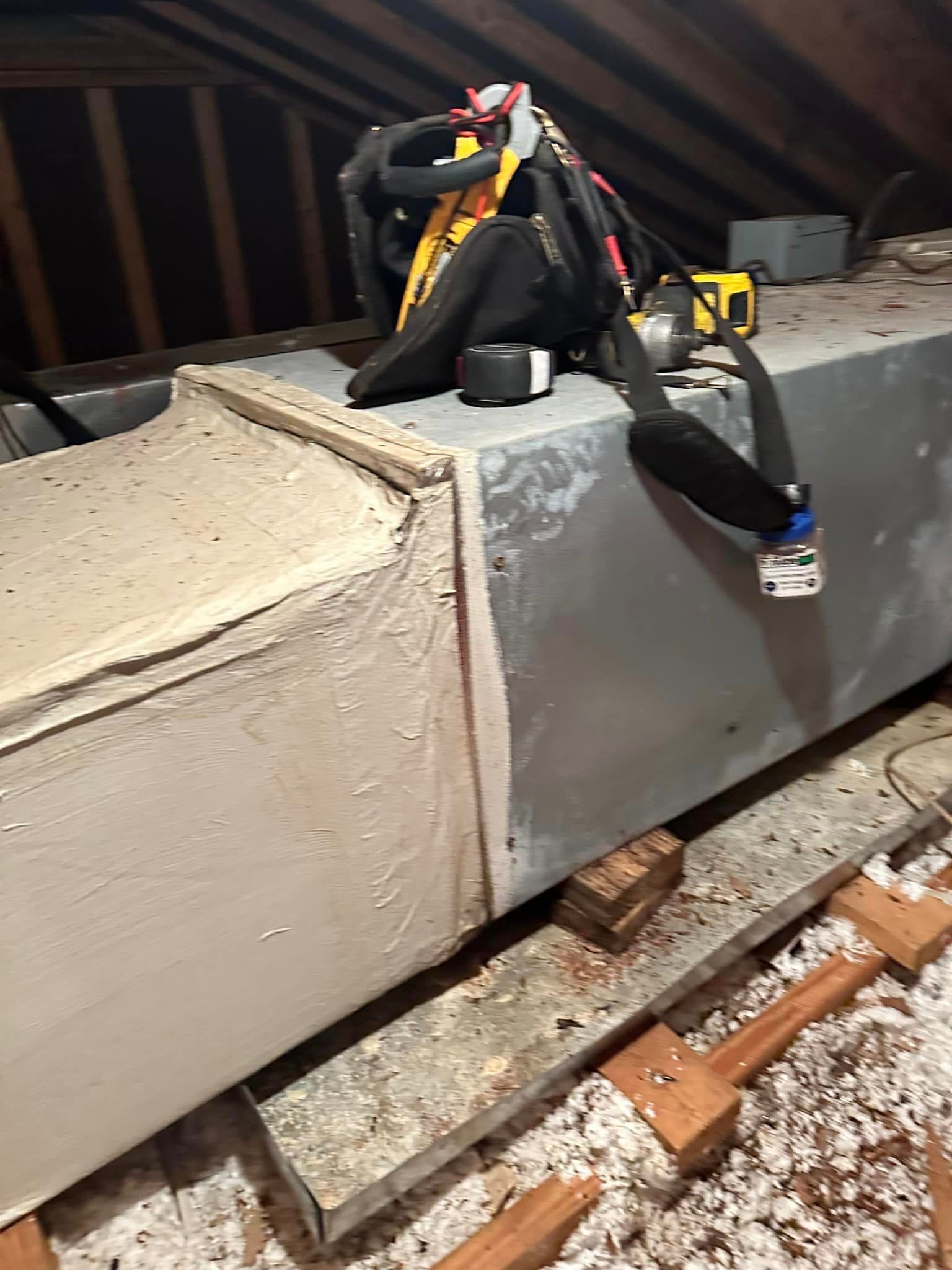 A piece of metal is sitting on top of a wooden table
