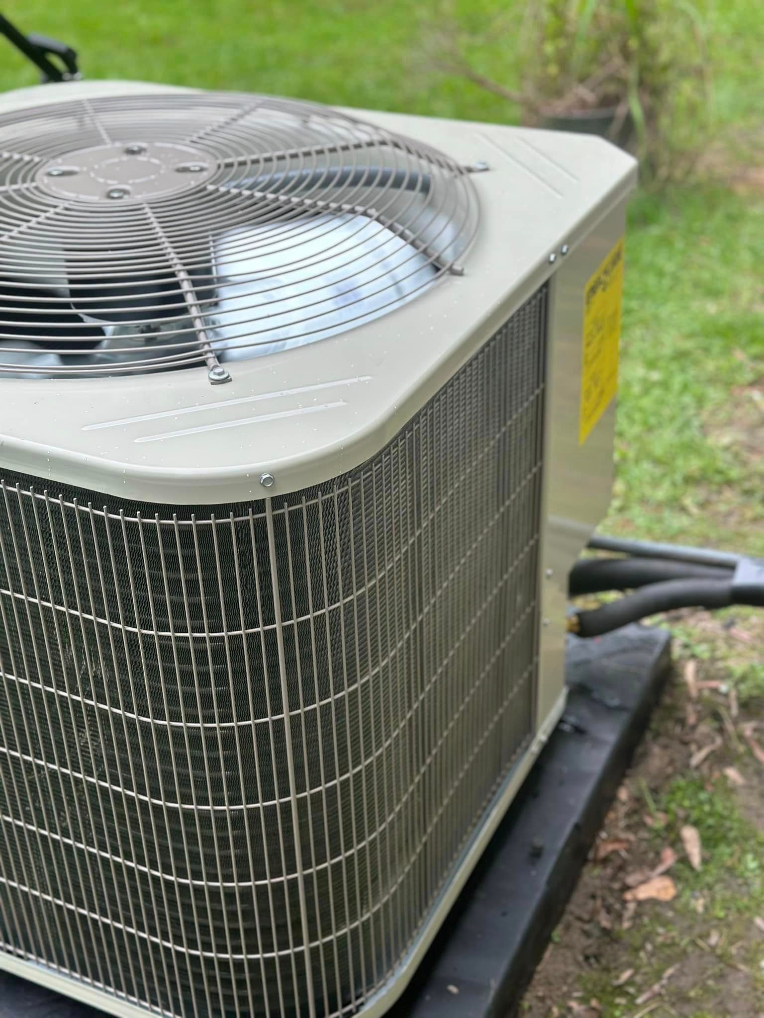 A large air conditioner is sitting on top of a black table