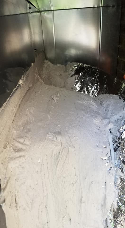 A pile of white powder is sitting on the floor in a room