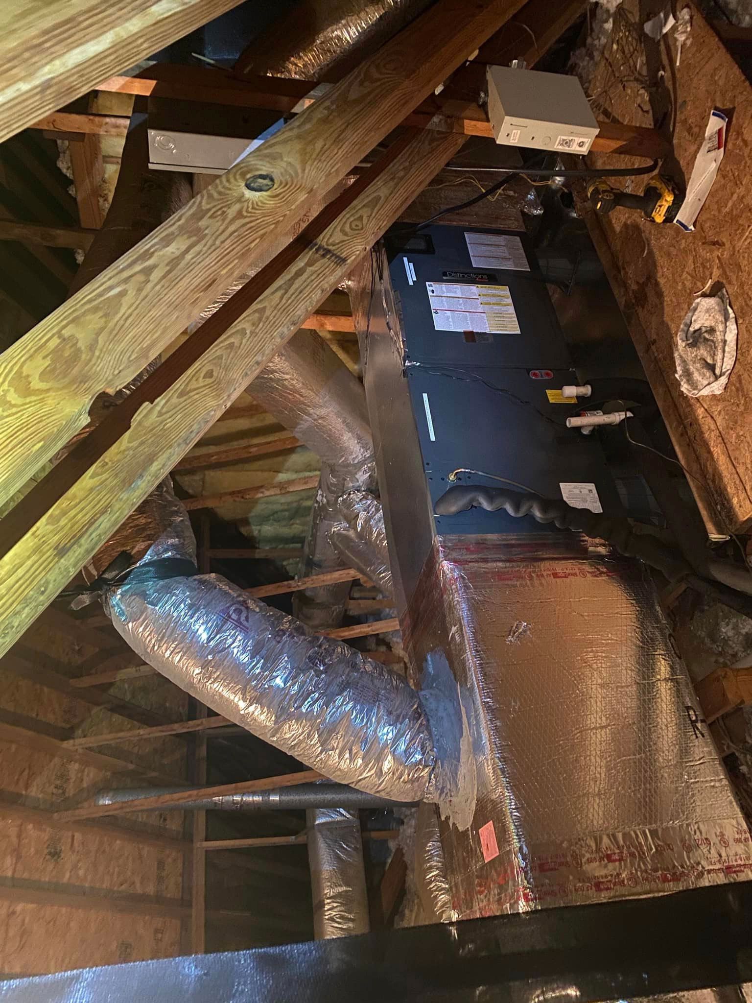 A ceiling with a lot of pipes coming out of it