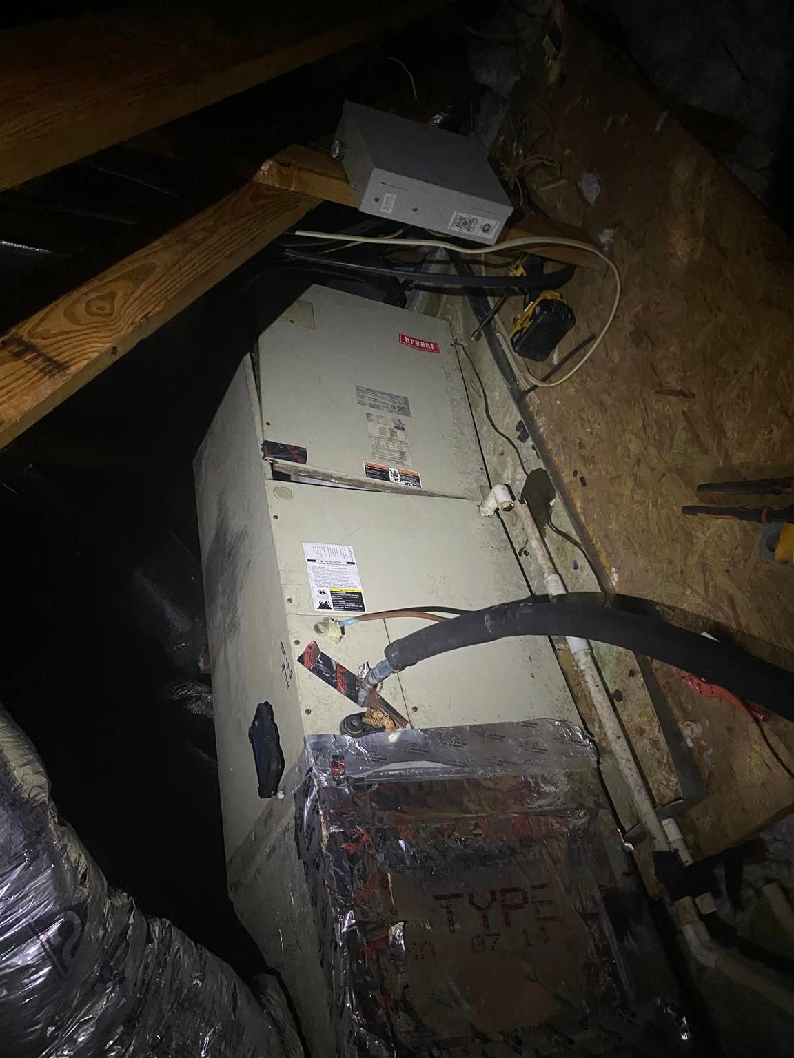 A white box with the word type written on it sits on a wooden floor